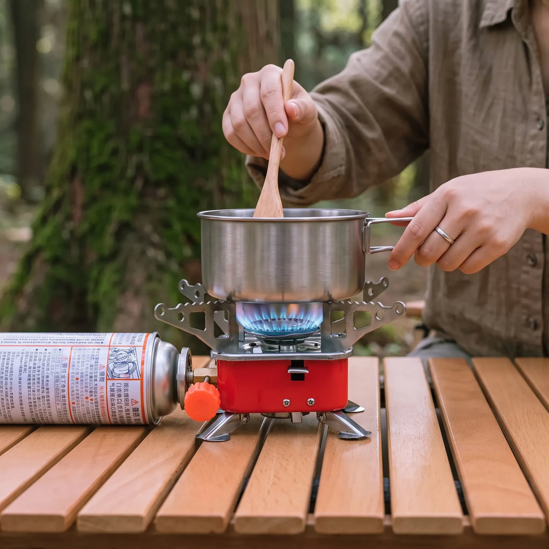 Folding portable camping stove for easy outdoor cooking. Ideal compact gas stove for hiking and camping meals.