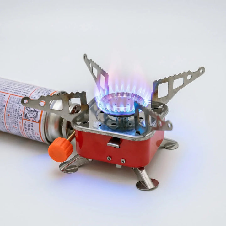 Portable compact folding camping stove for efficient outdoor cooking. Gas iron stove, great for hiking and camping.