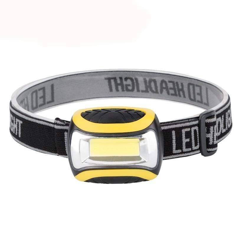 Compact LED headlamp torch on a black elastic band, perfect for hands-free outdoor adventures & camping