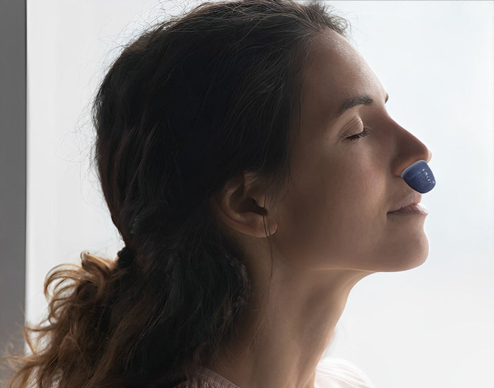 Portable anti-snoring sleep device providing quiet sleep apnea relief. Innovative breathing aid for users.