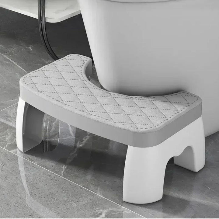 Compact non-slip toilet squat stool for improved posture & healthier bowel movements. Ergonomic bathroom aid.