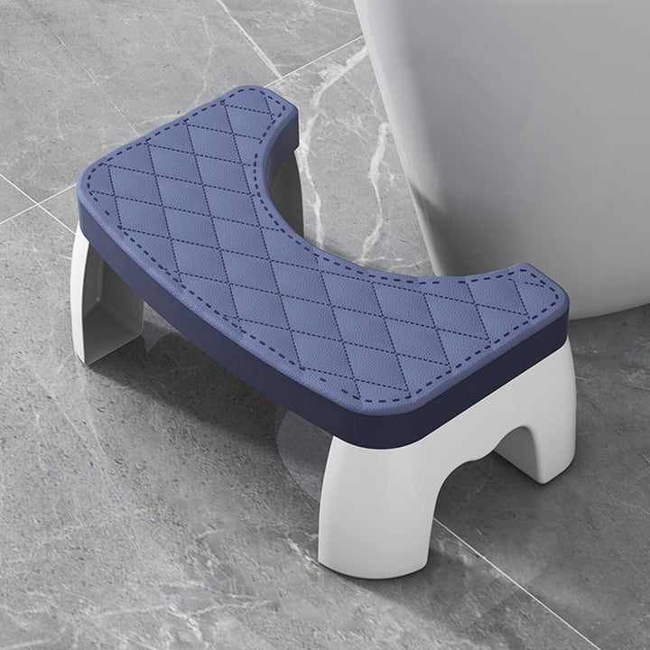 White compact non-slip squat stool. Safe and stable bathroom aid for proper toilet posture & comfortable use.