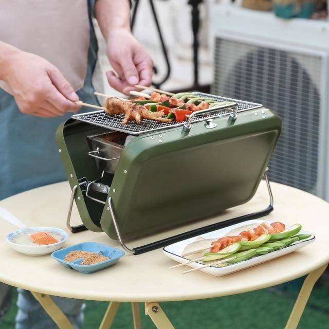 Compact portable folding BBQ grill, perfect for outdoor cooking and camping adventures.