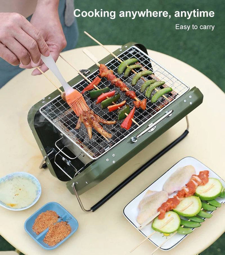 Collapsible BBQ grill with stand, convenient for picnics and tailgate parties.