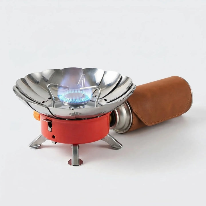 Foldable camping stove burner, ultra-light and portable, ideal for outdoor cooking and hiking gear.