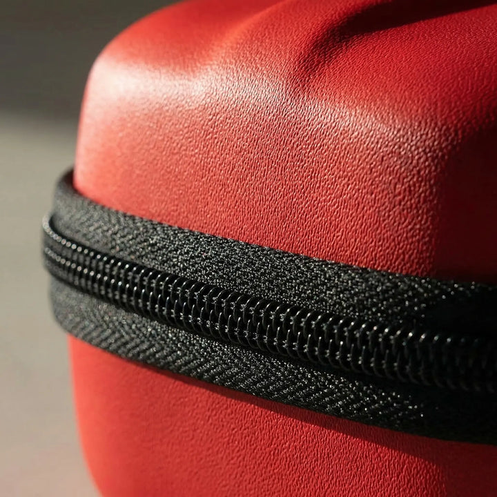 Portable red waterproof first aid kit for home, student, and outdoor emergency preparedness. Compact survival supplies.