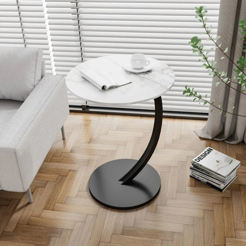 Convenient round accent table, compact and reinforced, an ideal small space solution for modern homes.