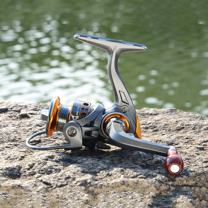 Detail shot of a mini fishing reel, showcasing its intricate design & durability
