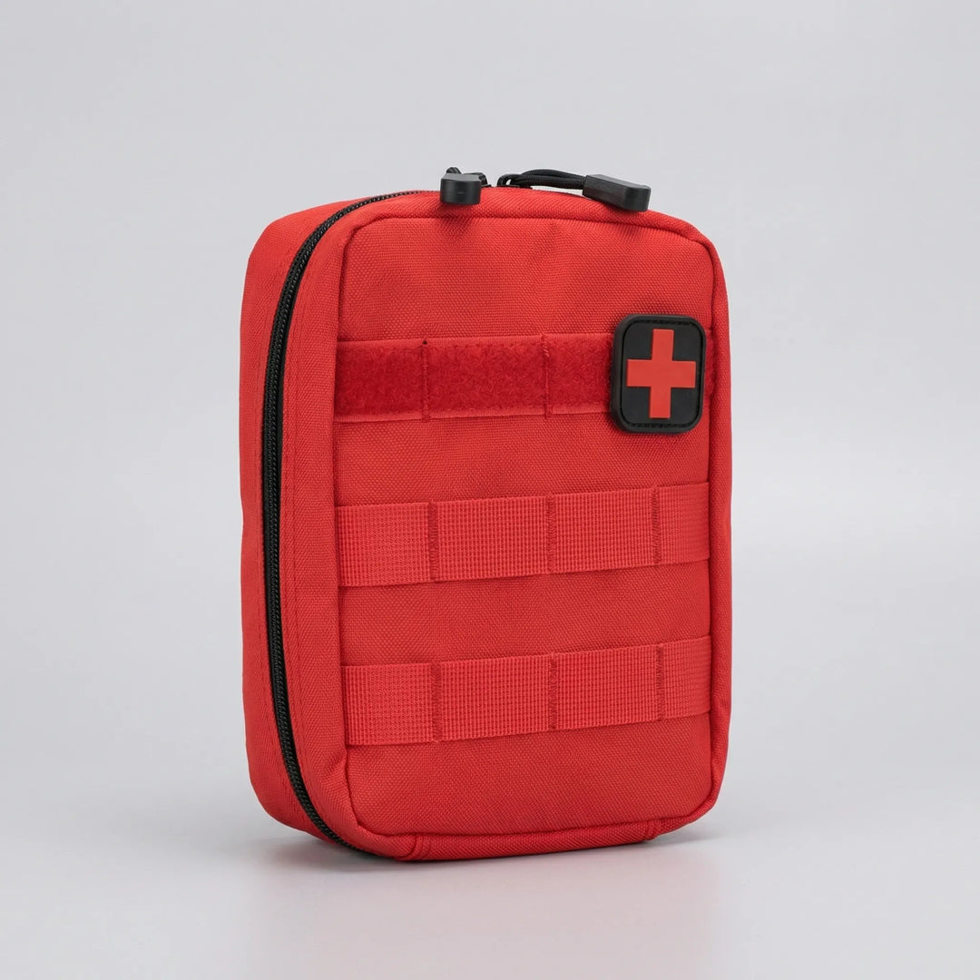 Tactical MOLLE first aid pouch, compact & durable, for attaching to backpacks, belts. Essential for outdoor survival.