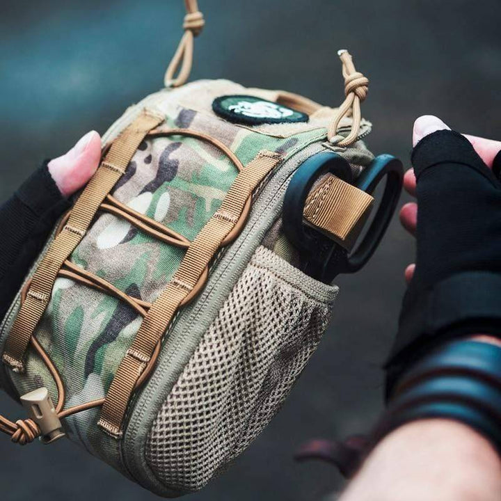 Compact tactical first aid trauma pouch in olive green, perfect for survival gear and hiking.