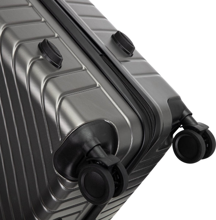 A close-up of the Valencia compact carry-on suitcase's robust hard shell, highlighting its secure TSA combination lock.
