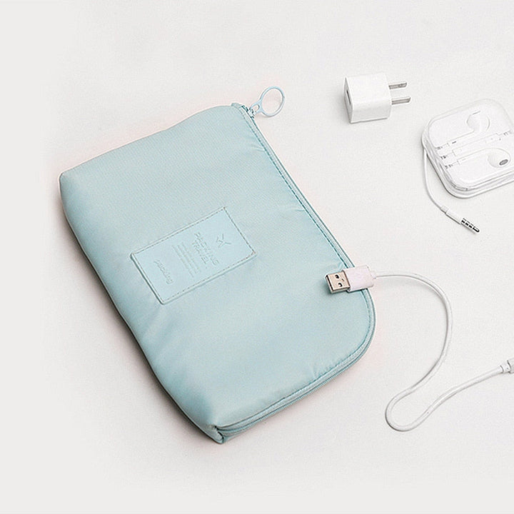 Ultra-compact travel organizer for electronics, waterproof & durable for any adventure.