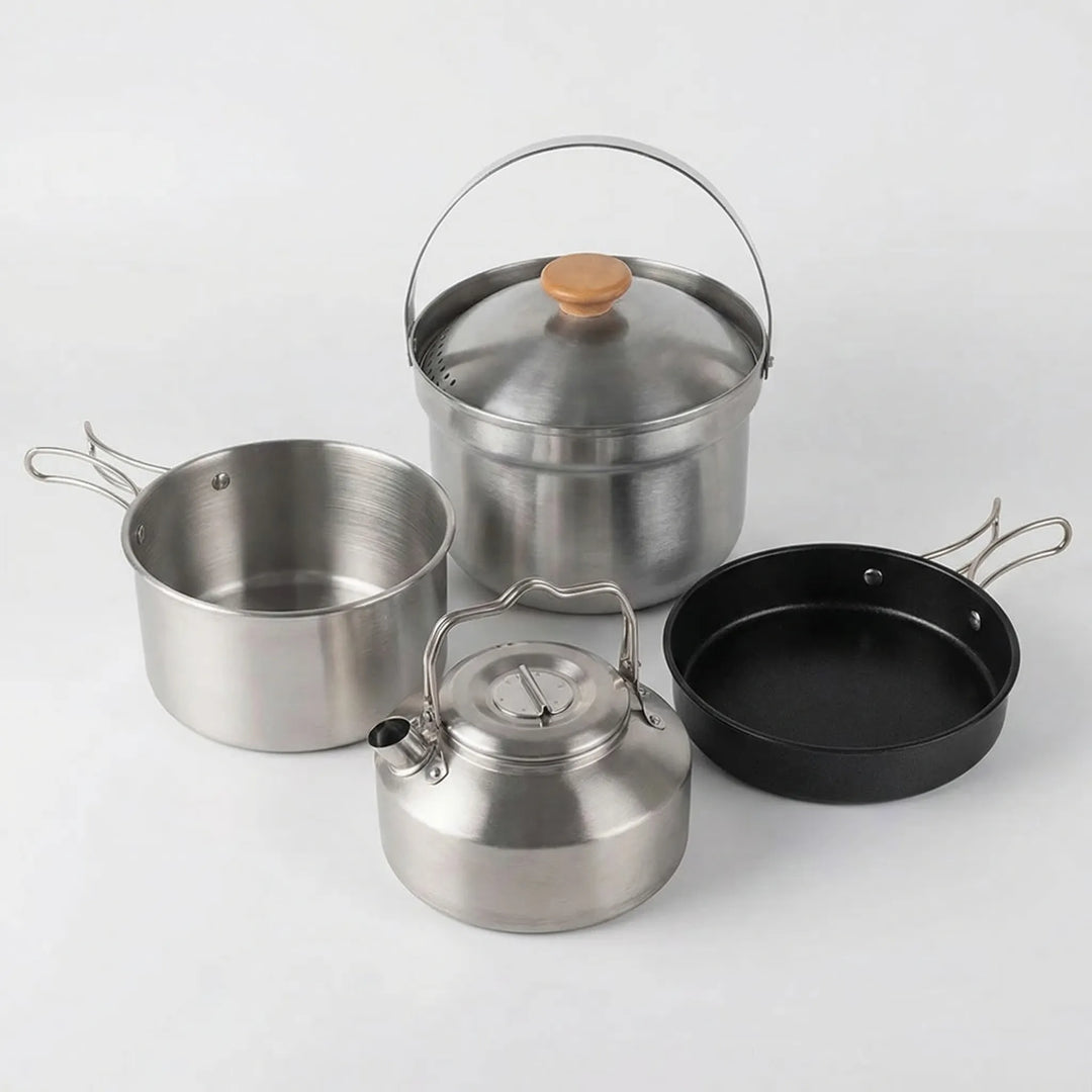 Durable camp kitchen cookware set with portable pot, frying pan, and kettle for bushcraft & outdoor cooking.