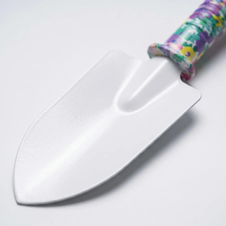 Close-up of a sturdy trowel, cultivator, & pruner from a 10-piece ergonomic gardening tool set for green thumbs.