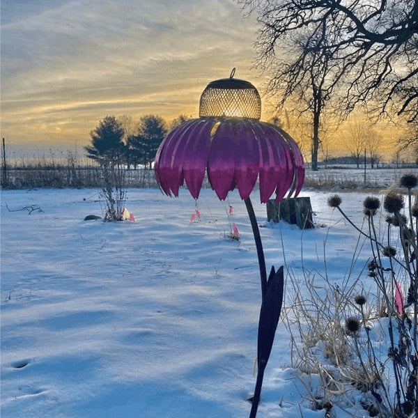 Outdoor metal coneflower bird feeder, a beautiful addition to garden decor, attracting wild birds for enjoyable birdwatching.