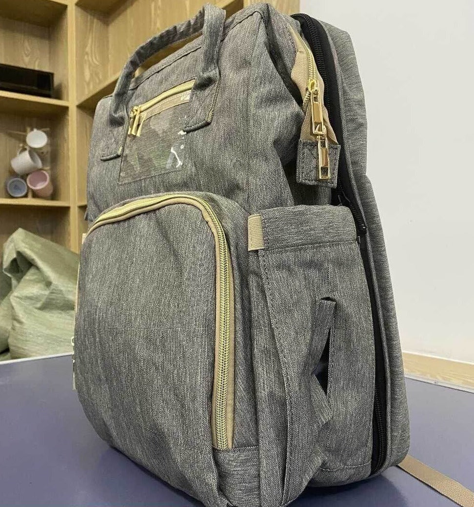 Ergonomic baby diaper backpack, comfortable for parents, featuring a multi-functional changing station.