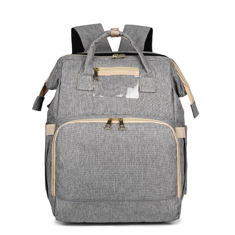 Multi-pocket waterproof diaper backpack showing organized compartments for baby bottles & essentials.