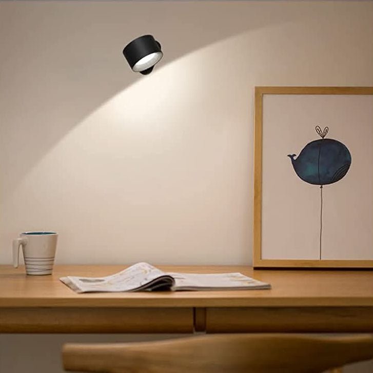 Sleek modern cordless LED wall lamp, rotatable for focused illumination. Enhances home decor, perfect for stylish lighting.