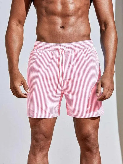 "Costume da bagno uomo a righe blu e bianche, design classico, tessuto leggero per comfort estivo, mare o piscina."