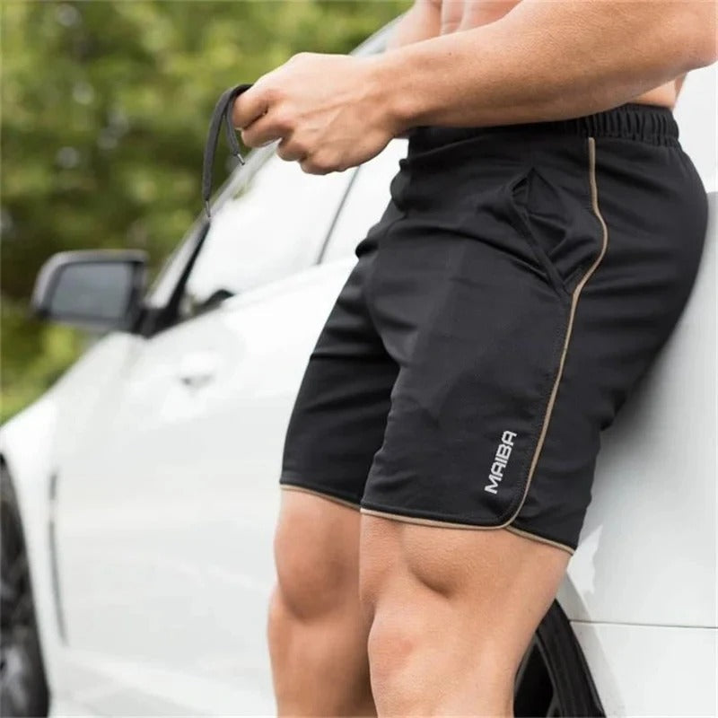 "Costume da bagno uomo slim-fit elasticizzato blu con vita regolabile, cuciture sottili e tessuto a rapida asciugatura."