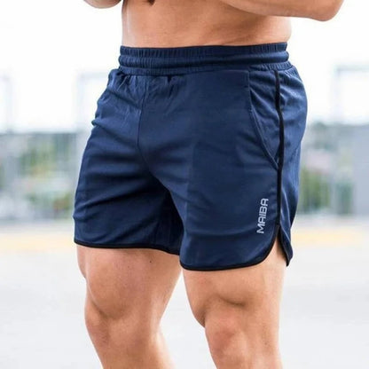 "Costume da bagno uomo slim-fit elasticizzato blu con vita regolabile, cuciture sottili e tessuto a rapida asciugatura."