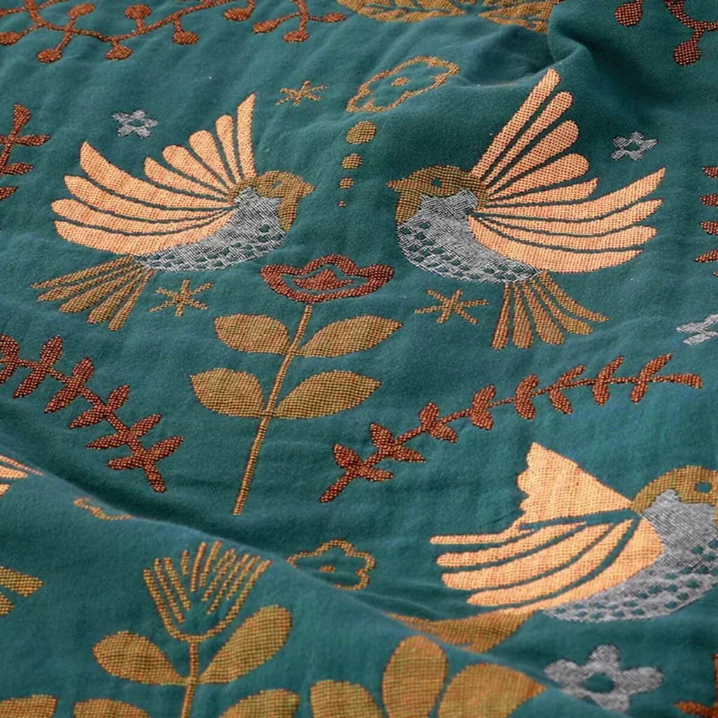 Soft cotton Scandinavian bird pattern throw blanket, reversible for versatile home decor or outdoor use. Unisex design.
