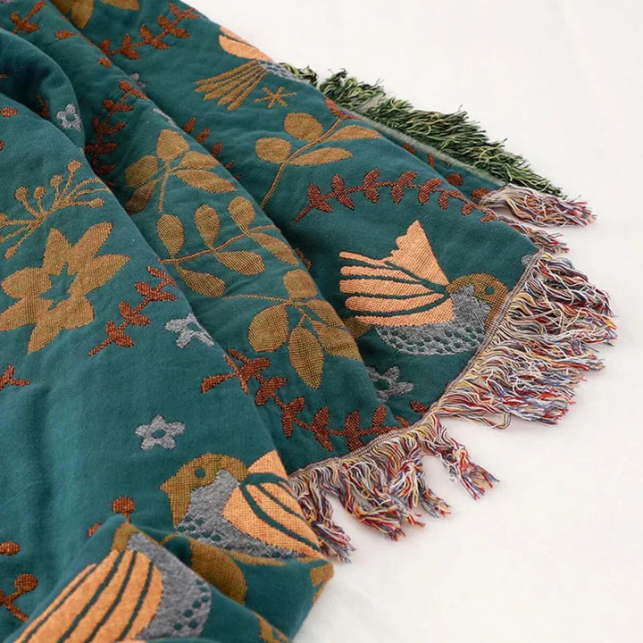 Unique reversible Scandinavian bird pattern throw. Luxurious cotton blanket for a cozy, stylish addition to your home.
