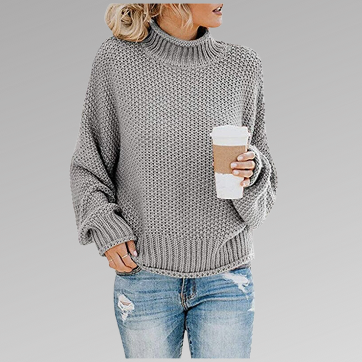 Soft chunky knit oversized turtleneck sweater for women, featuring long sleeves for cozy warmth.
