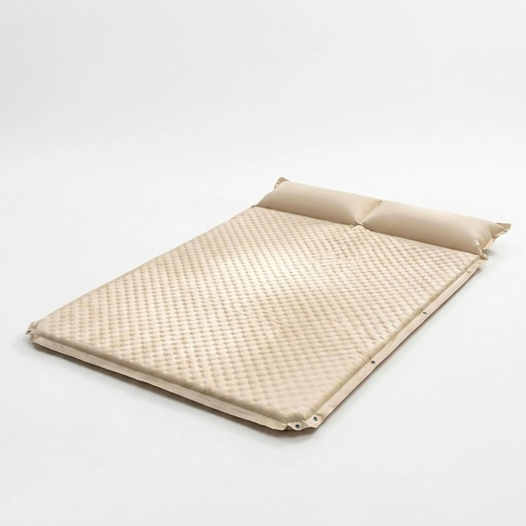 Portable cream self-inflating camping sleeping pad with pillow, perfect for backpacking, travel & outdoor use.