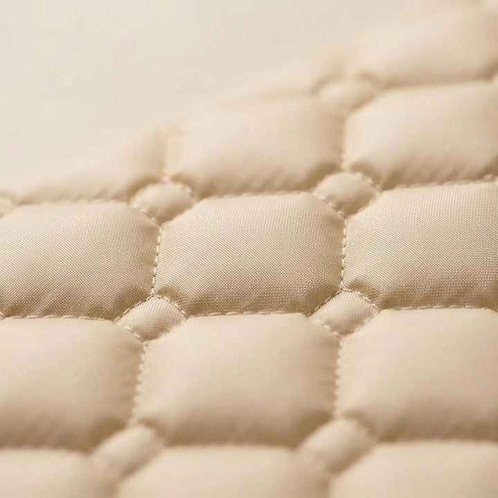 Unisex cream self-inflating camp mat with attached pillow, providing comfort for all outdoor adventures.