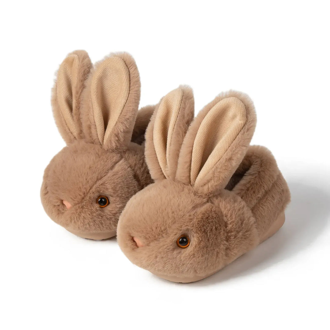 Brown plush bunny slippers for infants, soft and warm baby footwear with anti-slip grip.