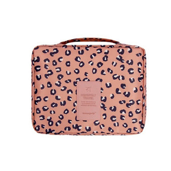 Women's waterproof makeup organizer, dark blue floral design, keeps cosmetics safe & organized for travel.