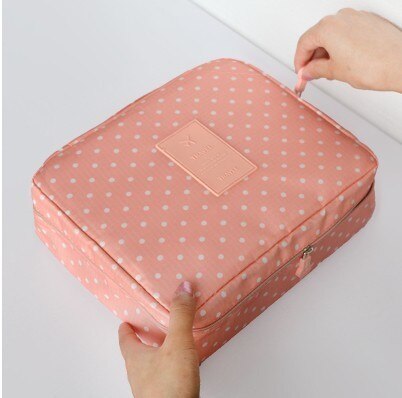 Women's portable dark blue floral waterproof makeup organizer, perfect for beauty essentials on the go.