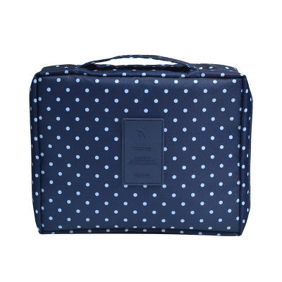 Portable dark blue floral waterproof makeup travel bag, designed for efficient cosmetic organization.