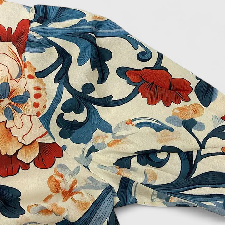 Elegant dark blue women's floral blouse, featuring chic 3D details. A versatile top for modern everyday fashion.