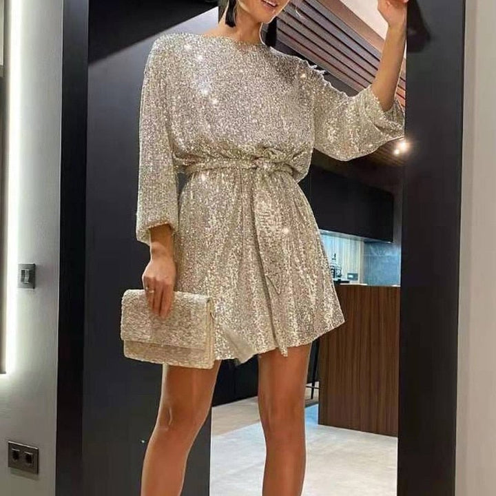 Elegant women's sequin mini dress with dazzling shimmer; stylish evening wear for special occasions.