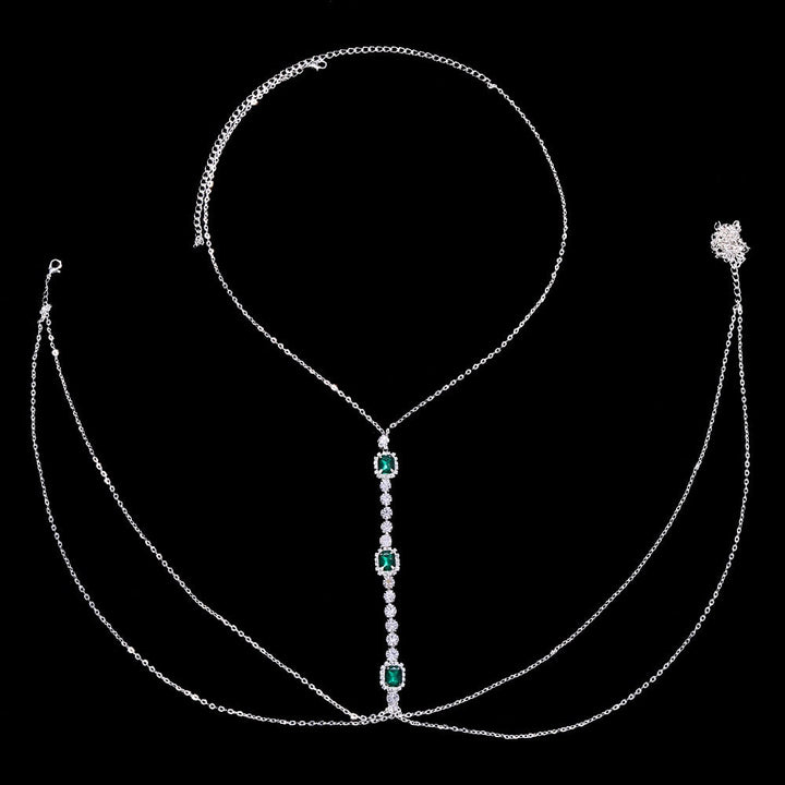 Sparkling women's green crystal chest chain. Festival-ready rhinestone body jewelry, a dazzling and elegant statement.