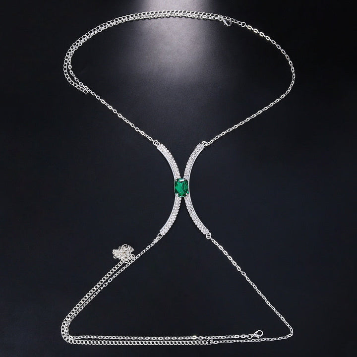 Women's gold tone rhinestone body chain, a dazzling crystal chest chain. Elegant fashion accessory for special occasions.