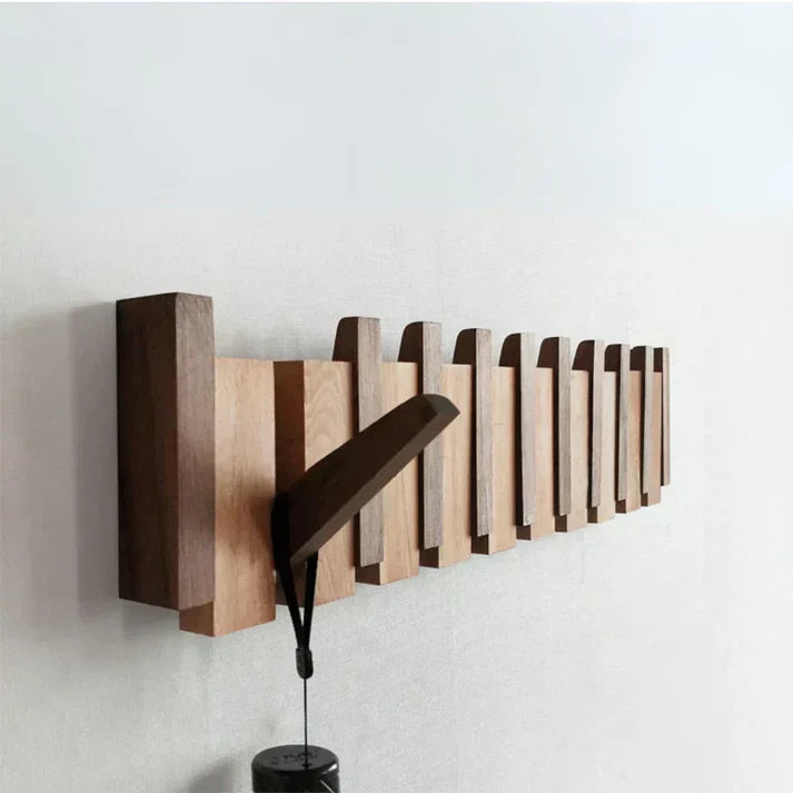 Decorative wooden piano coat hook rack for entryways. Stylish wall organizer & home storage solution.