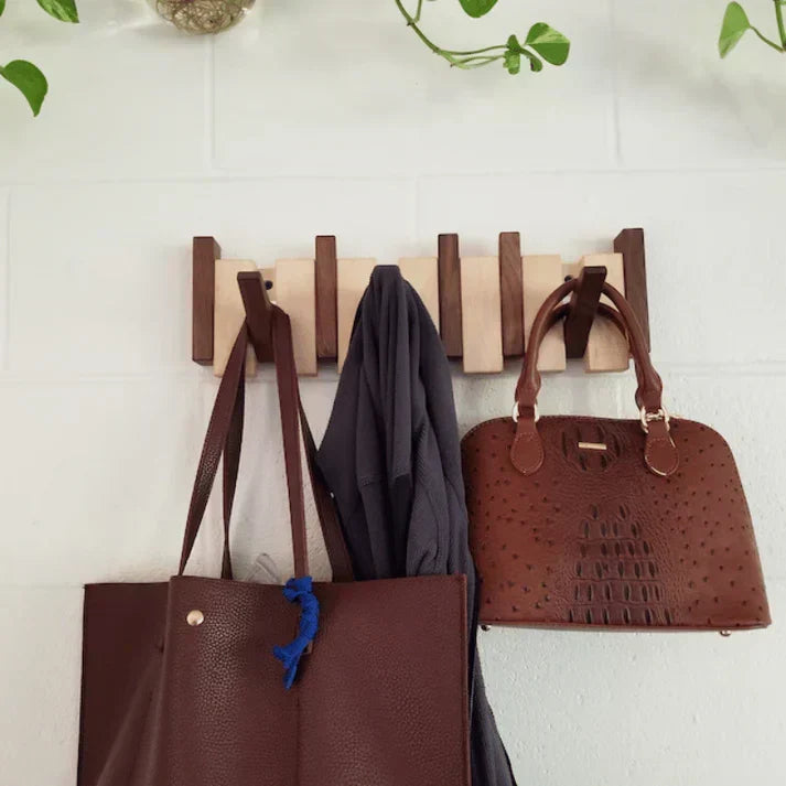 Elegant wooden piano design coat rack with multiple hooks. Perfect for entryway decor & organization.