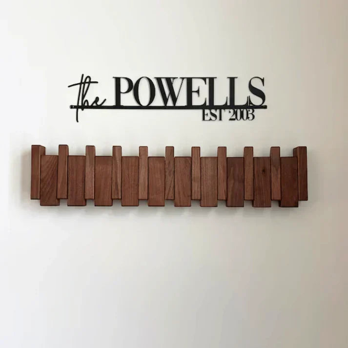 Close-up of a wooden piano coat rack showing intricate wood hooks & design. Ideal for home storage.