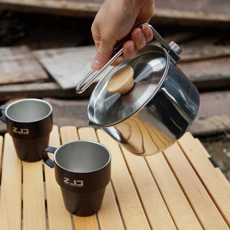 Compact stainless steel camping kettle with handle, suitable for all outdoor cooking and camping needs.