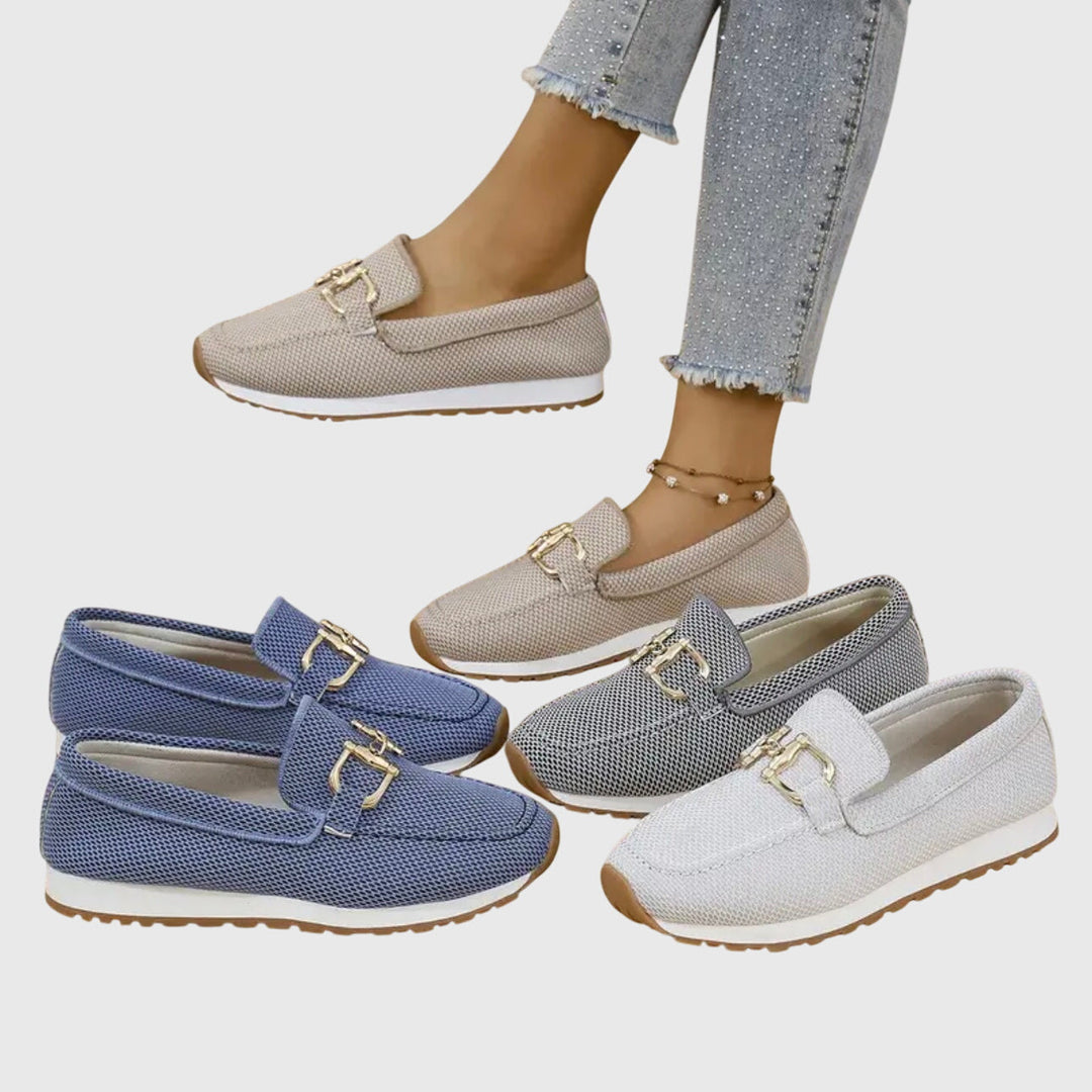 Elegant dusty blue women's horsebit loafers. Comfortable slip-on footwear, perfect for versatile daily outfits.