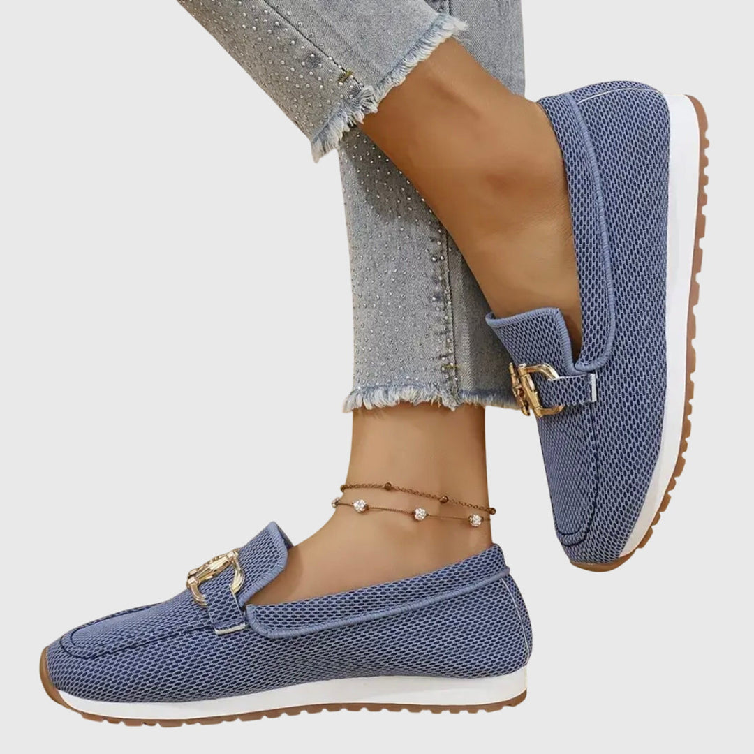 Versatile dusty blue horsebit loafers for women. Slip-on casual flats, ideal for a preppy fashion look.