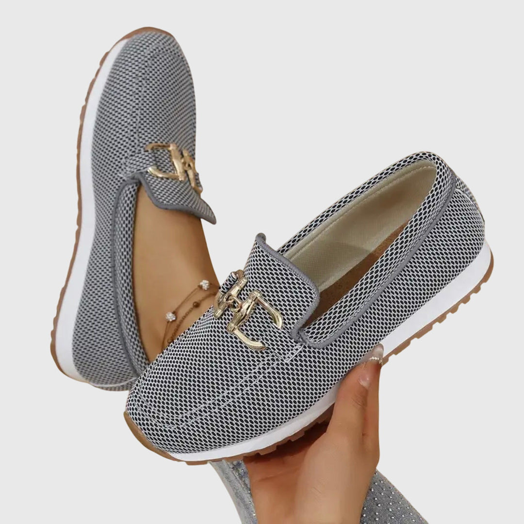 Dusty blue women's horsebit loafers in a front view. Comfortable slip-on shoes for casual and stylish wear.