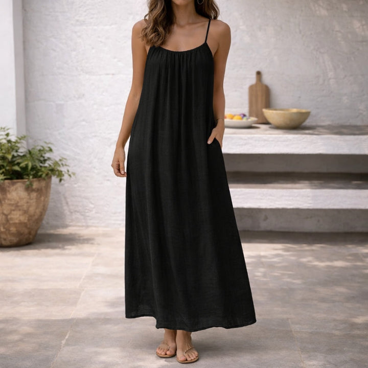 Comfortable ladies' spaghetti strap sundress with pockets, a stylish choice for summer.