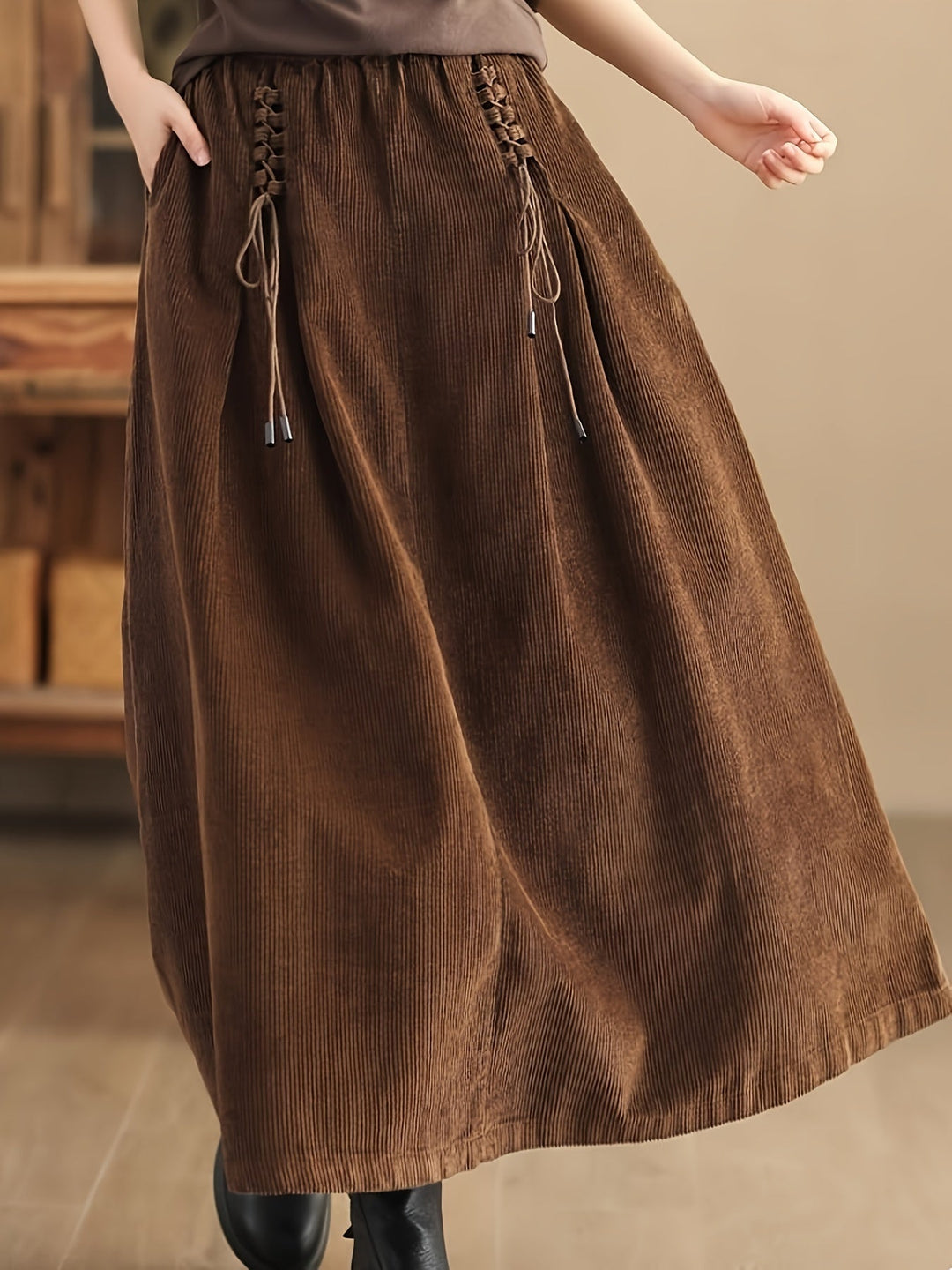 Fashionable women's A-Line maxi skirt with practical pockets & elegant corset detail for any event.
