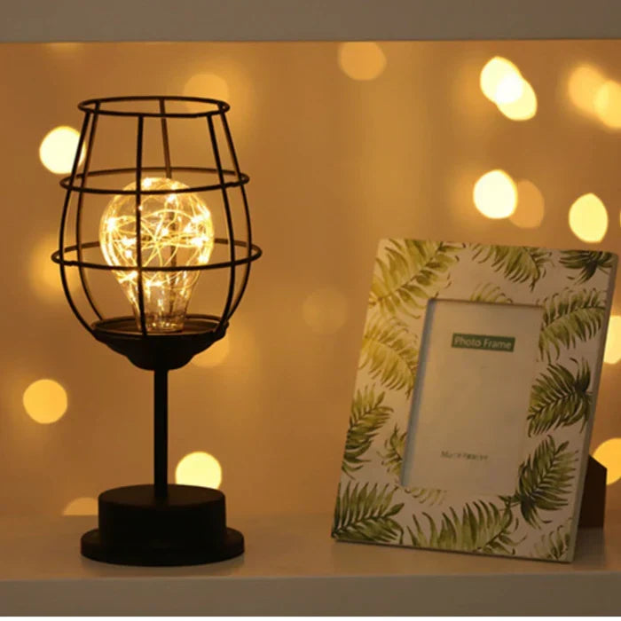 Modern black table lamp enhances bedroom decor. Stylish lighting for a luxurious atmosphere.