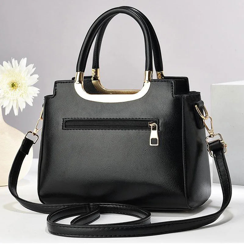 Luxurious green structured handbag, a chic fashion accessory & women's crossbody purse.