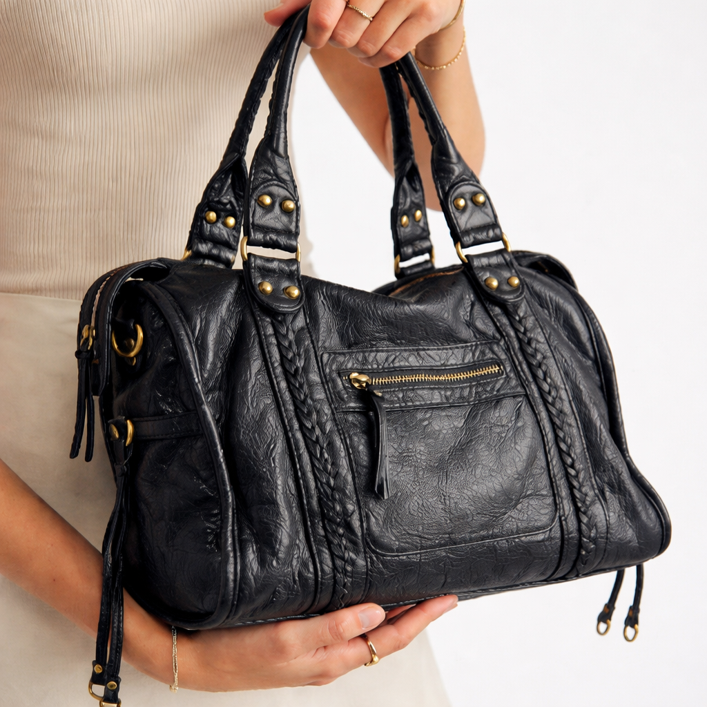 Elegant black women's shoulder bag with a sleek design, perfect for daily carry and versatile fashion. Chic handbag.